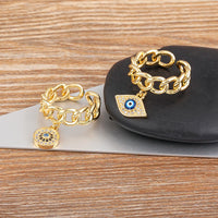 Anillo Ojo Turco Colgante y Mano de Fátima