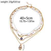 Collar con colgante de Palma de ojos malvados azules de la suerte turco con sentido del diseño para mujer, elegante collar de perlas de imitación, joyería multicapa
