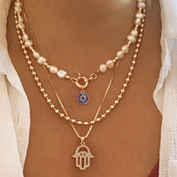 Collar con colgante de Palma de ojos malvados azules de la suerte turco con sentido del diseño para mujer, elegante collar de perlas de imitación, joyería multicapa
