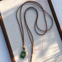 Elegante collar con colgante de ojo de diablo de pez verde con articulaciones móviles con cuerda marrón, cadena larga para suéter, joyería de moda para mujer