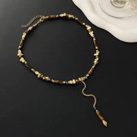 Collar con colgante de cuentas de piedra ojo de tigre de estilo vintage, para mujer, de inspiración bohemia, con diseño irregular en forma de Y y borlas, ideal como accesorio de joyería para fiestas.