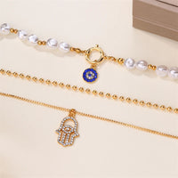 Collar con colgante de Palma de ojos malvados azules de la suerte turco con sentido del diseño para mujer, elegante collar de perlas de imitación, joyería multicapa