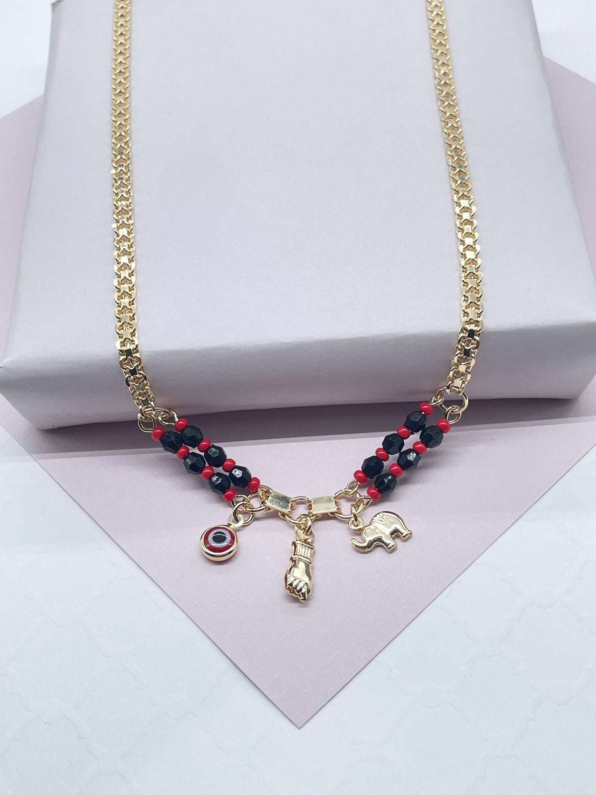 Collar con dije de oro laminado de 18k: mano de Figa, ojo turco, elefante.
