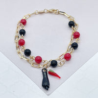 18k Gold Layered Bracelet with black and red beads and Pepper & Figa Charms