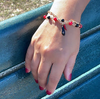 18k Gold Layered Bracelet with black and red beads and Pepper & Figa Charms