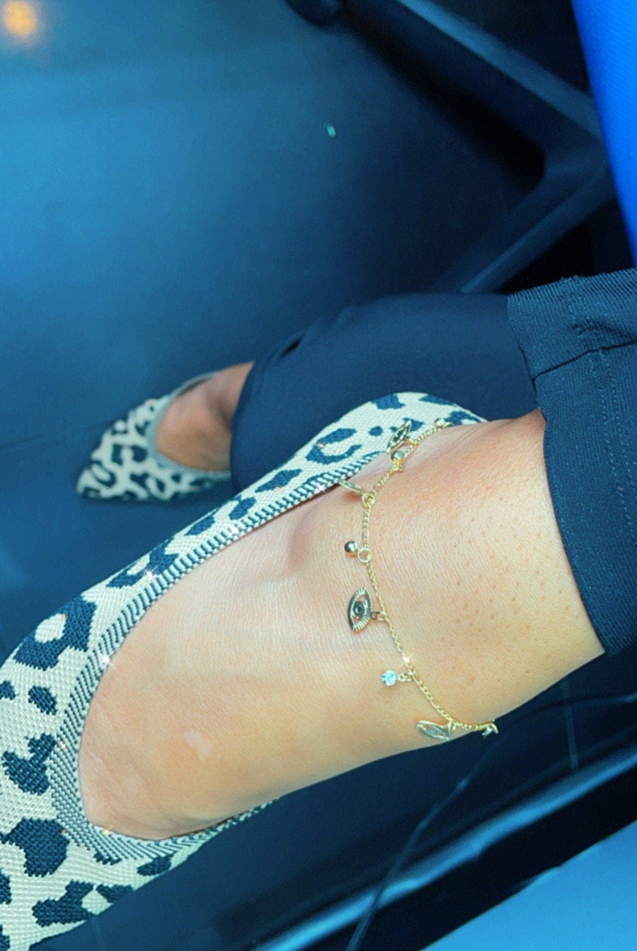 18k Gold Layered Plain Evil Eye Charms and Cubic Zirconia Hanging in a Figaro